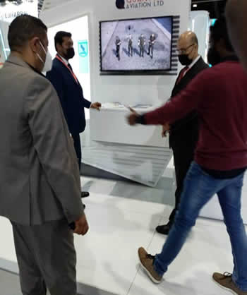 Delegates meeting at the Quantum Aviation stand during IDEX 2021